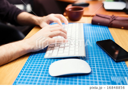 Close up of male hands typing. Selective focus 16848856