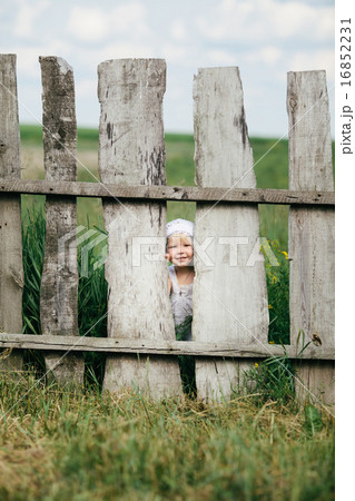 little girl and wooden fence 16852231