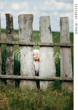 little girl and wooden fence little girl and wooden fence 16852232