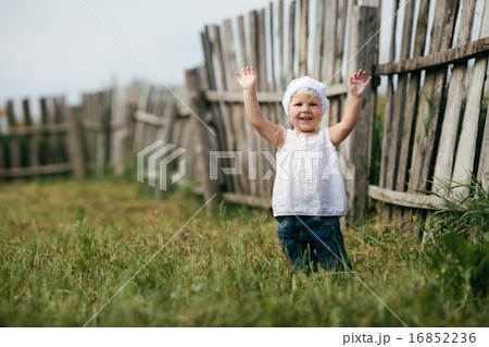 little girl and wooden fence 16852236