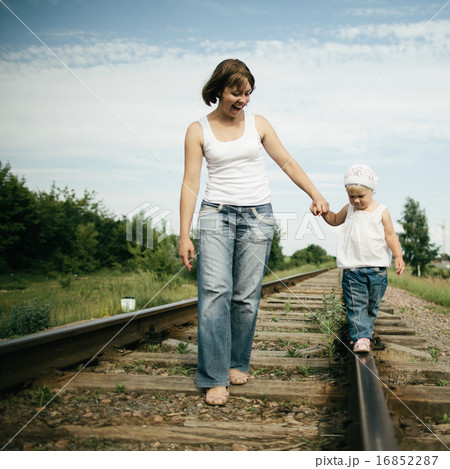 happy mother with baby on railroad happy mother with baby on railroad 16852287
