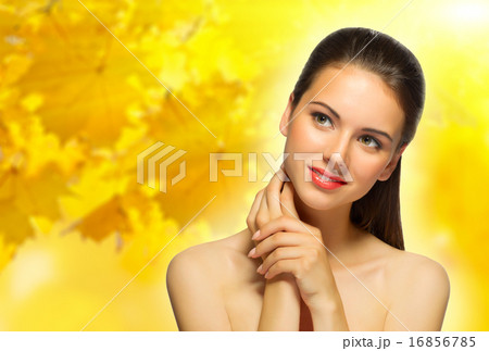 Young woman on autumnal background Young woman on autumnal background 16856785
