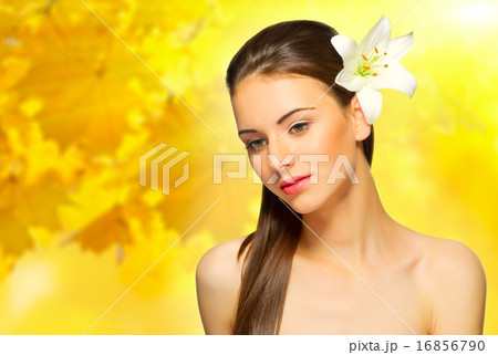 Girl with flower on autumnal background 16856790