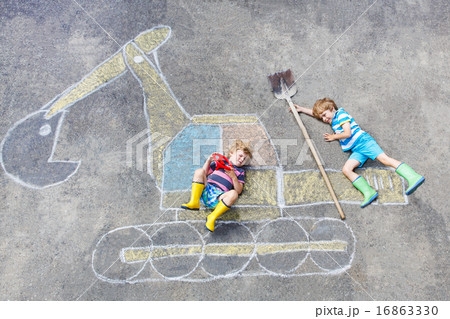 Two little kid boys with excavator chalk picture 16863330