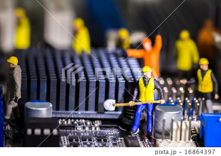 Team of engineers repairing circuit mother board Team of engineers repairing circuit mother board 16864397