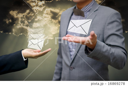Businessman get email in hand with shiny sky 16869278
