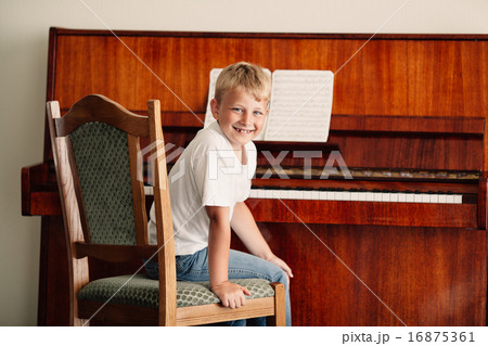 little happy boy plays piano little happy boy plays piano 16875361
