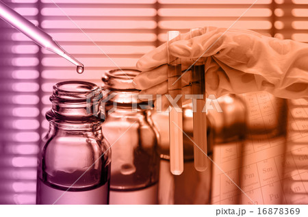 Chemical Laboratory,scientist dropping the reagent into test fla 16878369