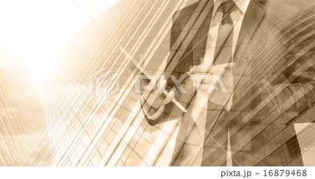 Double exposure of businessman with cityscape building glass Double exposure of businessman with cityscape building glass 16879468