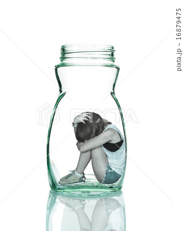Sad woman sitting alone in a jar Sad woman sitting alone in a jar 16879475