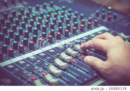 Hand adjusting audio mixer Hand adjusting audio mixer 16880138