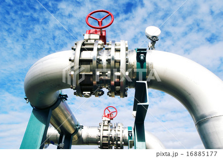 Industrial pipelines and valves against blue sky Industrial pipelines and valves against blue sky 16885177