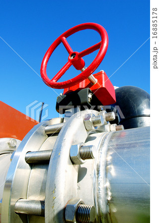Industrial pipelines and valves against blue sky 16885178