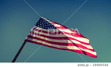 American flag with stars and stripes hold with hands against blu American flag with stars and stripes hold with hands against blu 16900588