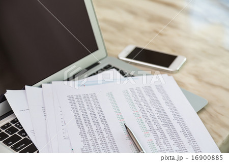 Financial charts on the table with laptop Financial charts on the table with laptop 16900885