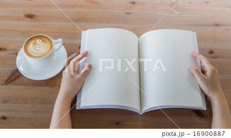 Hands open Blank catalog, magazines,book mock up on wood table w 16900887