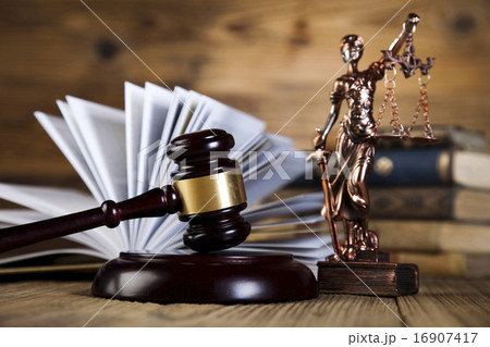 Wooden gavel and books, ambient light vivid theme 16907417