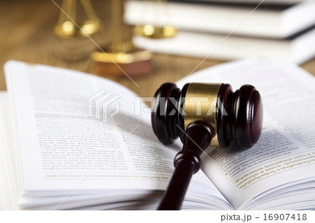 Wooden gavel and books, ambient light vivid theme Wooden gavel and books, ambient light vivid theme 16907418