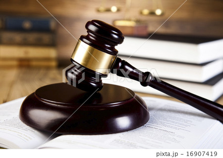Wooden gavel and books, ambient light vivid theme 16907419