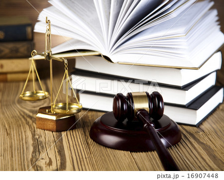 Wooden gavel and books, ambient light vivid theme Wooden gavel and books, ambient light vivid theme 16907448