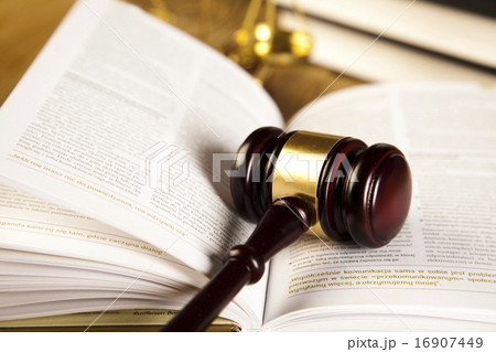 Wooden gavel and books, ambient light vivid theme Wooden gavel and books, ambient light vivid theme 16907449