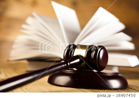 Wooden gavel and books, ambient light vivid theme Wooden gavel and books, ambient light vivid theme 16907450