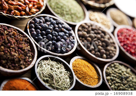 Assortment of spices in wooden bowl background Assortment of spices in wooden bowl background 16908938
