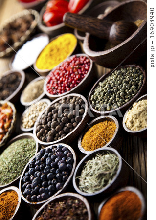 Assortment of spices in wooden bowl background 16908940