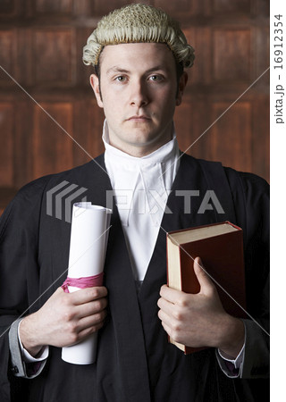 Portrait Of Male Lawyer In Court Holding Brief And Book 16912354