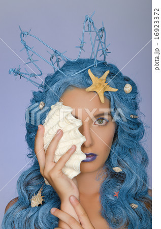 Portrait of woman with blue hair, shells and crown 16923372