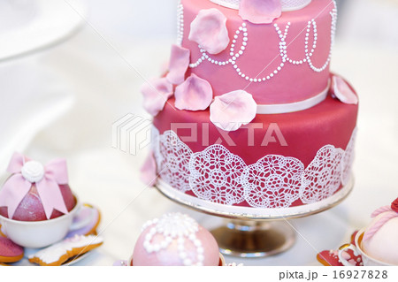 White wedding cake decorated with sugar flowers 16927828