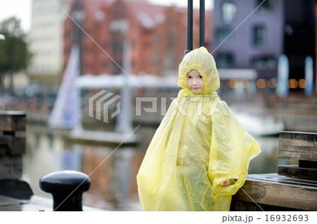 Adorable little girl in a rain coat Adorable little girl in a rain coat 16932693