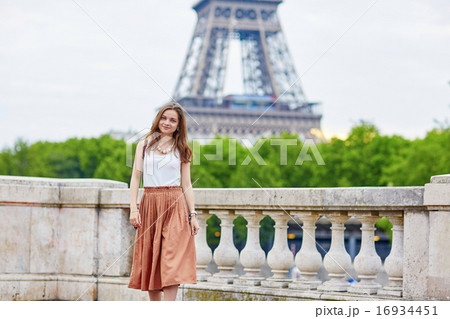 Beautiful young Parisian woman near the Eiffel tower 16934451
