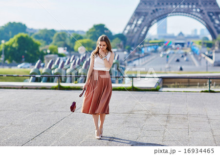 Beautiful young Parisian woman near the Eiffel tower 16934465