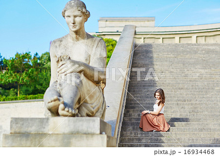 Beautiful young Parisian woman in long brown silk skirt 16934468
