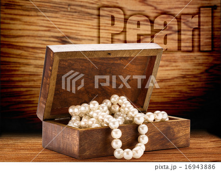 Wooden chest with white pearl necklace Wooden chest with white pearl necklace 16943886