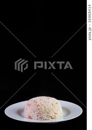 Rice in a dish on black background 16968414