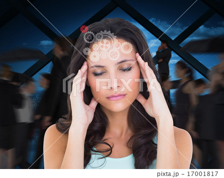 Composite image of pretty brunette with a headache 17001817