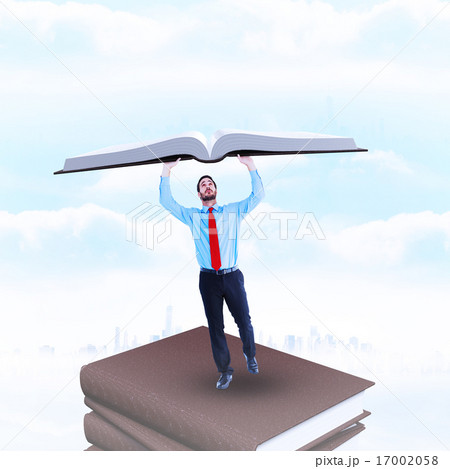 Composite image of businessman in suit pushing up with effort 17002058