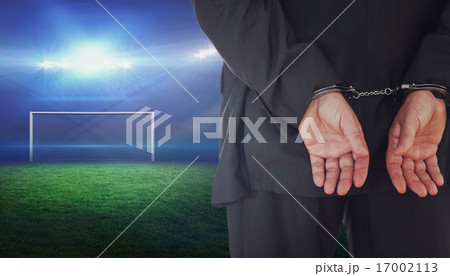 Composite image of businessman in handcuffs 17002113