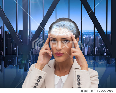 Composite image of young businesswoman putting her fingers on he 17002205