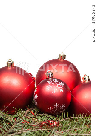 red Christmas balls on green fir tree branch 17005843