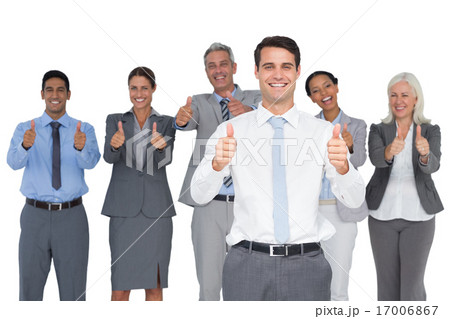 Happy business people looking at camera with thumbs up 17006867
