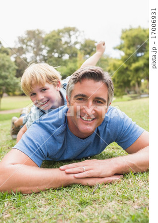 Happy father and his son smiling at camera Happy father and his son smiling at camera 17006931