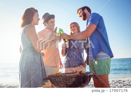 Happy friends doing barbecue and drinking beer 17007176