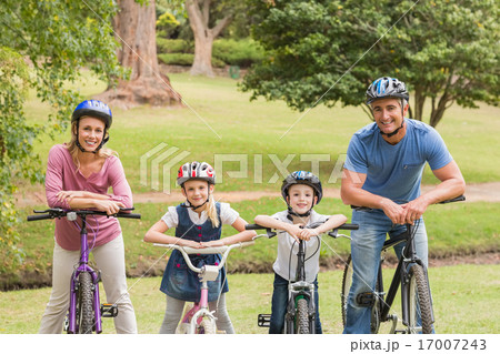 Happy family on their bike at the park 17007243