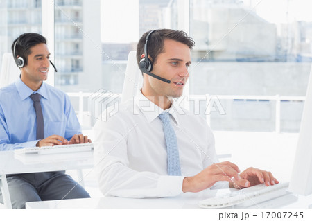 Concentrate work team using computer 17007245