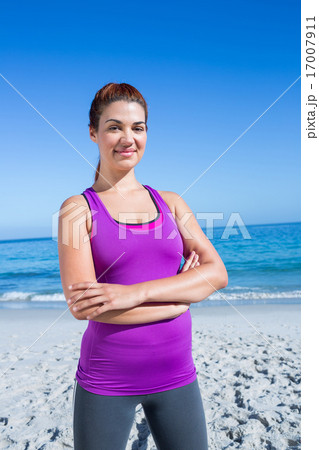 Fit brunette looking at camera arms crossed 17007911