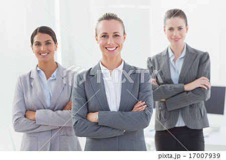 Business team standing arms crossed Business team standing arms crossed 17007939