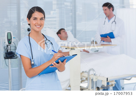 Doctors taking care of patient Doctors taking care of patient 17007953